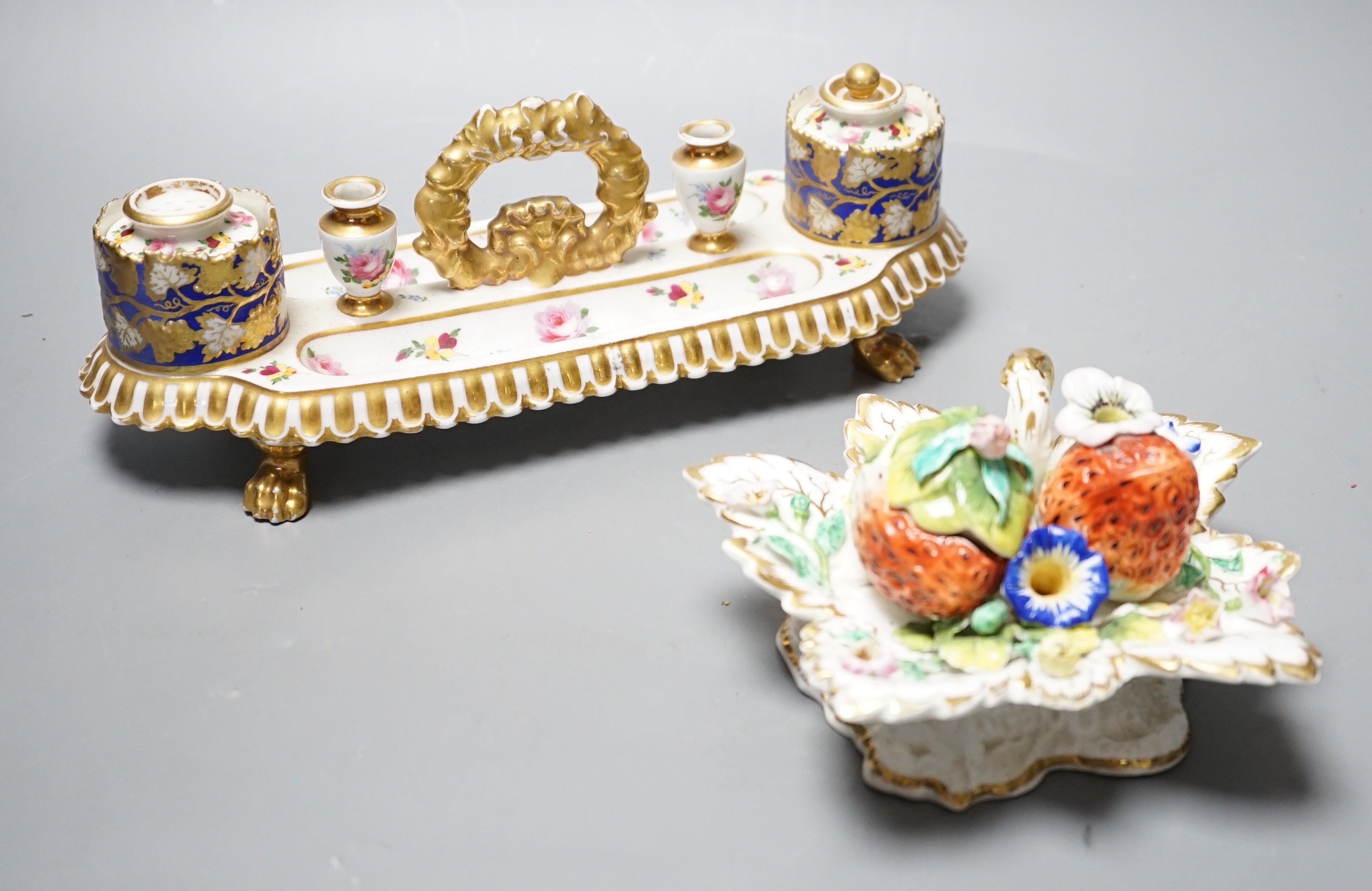 A 19th century Chamberlain Worcester inkstand painted with roses and heatsease, script mark, and a 19th century English porcelain leaf shaped inkwell with strawberry shaped wells, encrusted with flowers picked out in gil